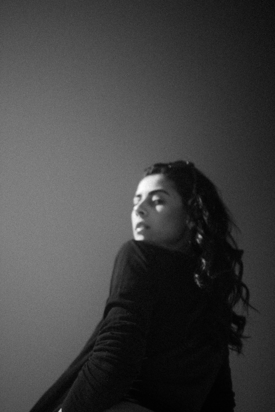 A woman shot from below. A little bit blurred and a lot of grain. Strange pic, shot on black and white