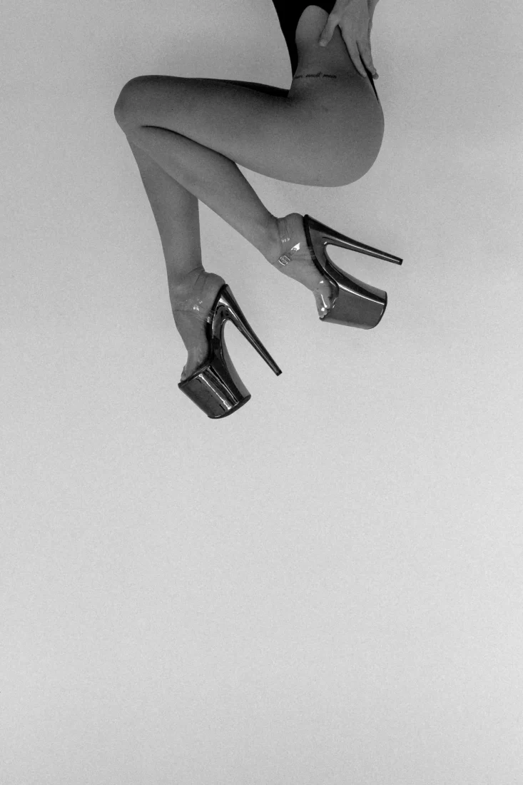 I really dont know how to describe this one. Half of a womans body and some nice heels. Upside down? Shot on black and white