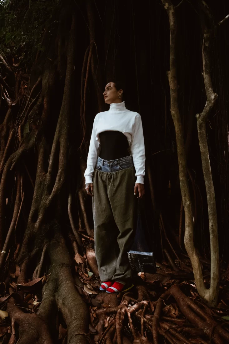 A Woman in the middle of huge roots