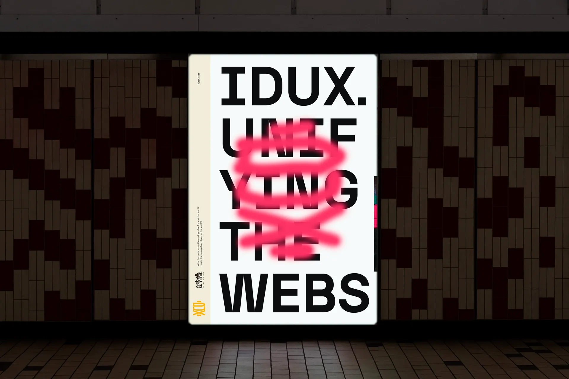 Experimental typographic poster displayed in a subway station, featuring bold black lettering reading ‘IDUX. UNIFYING THE WEBS’ with the central words crossed out by a bright pink spray-paint stroke. The composition blends minimal graphic design with disruptive visual language, showcasing brand identity exploration for DUX. Creative direction by Rodrigo Baumgratz, integrating contemporary typography, urban context, and conceptual storytelling
