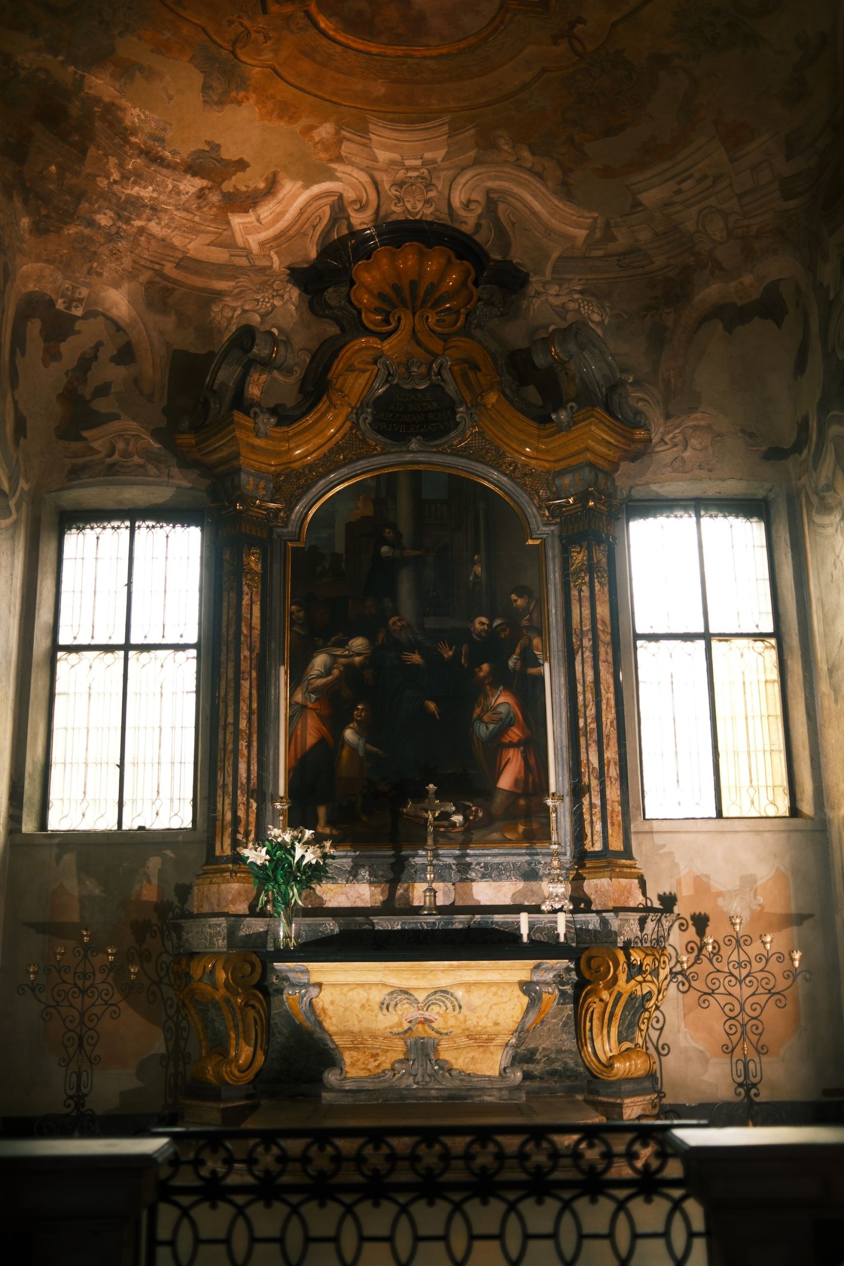 Color photograph of a richly detailed baroque altar in Milan, with dramatic lighting and frescoes, highlighting sacred architecture through a bold artistic lens